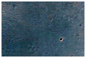 Light-Toned Layered Material along Ius Chasma Plateau