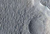 Crater with Intersecting Faults in Tempe Terra
