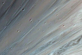 Small Crater in Rim of Larger Crater Southwest of Isidis Planitia
