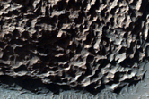 Possible Phyllosilicates in Knob Features Northwest of Hellas Planitia

