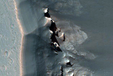 Pit in Eastern Noctis Labyrinthus with Jarosite

