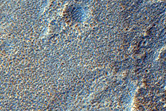 Channels along Edge of Ejecta of Crater in Northern Arabia Terra
