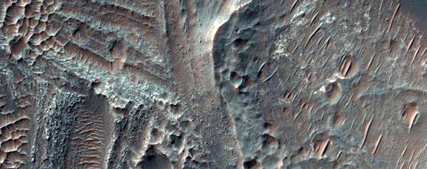 Layered Deposits in Central Pit of Large Crater
