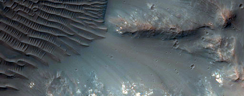 Impact Crater Exposing Bedrock
