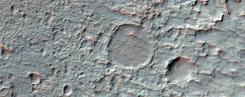 Fan and Layered Material in Crater Near Vichada Valles
