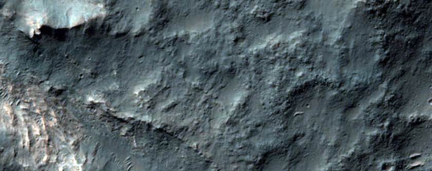 Light-Toned Chaos Material along an Older Crater Rim
