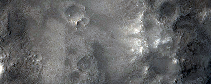 Possible Phyllosilicates in Crater Ejecta along Dichotomy Boundary
