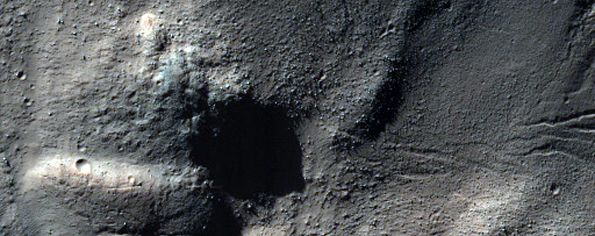 Small Gullies and Distinct Layer in Horowitz Crater
