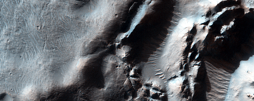Impact Crater Exposing Bedrock
