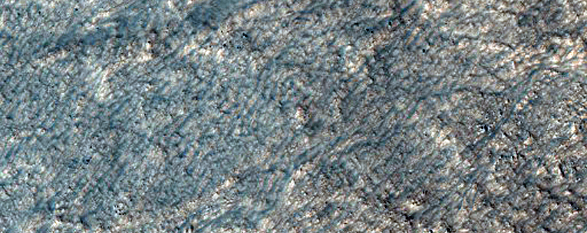Mounds with Cracks and Smooth Terrain in Lyot Crater
