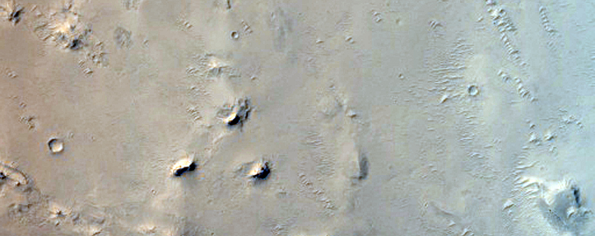 Layered Deposits and Dunes in Arabia Terra
