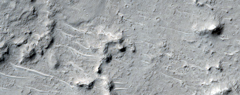 Butte and Mesa-Forming Material in Cratered Highlands Depression
