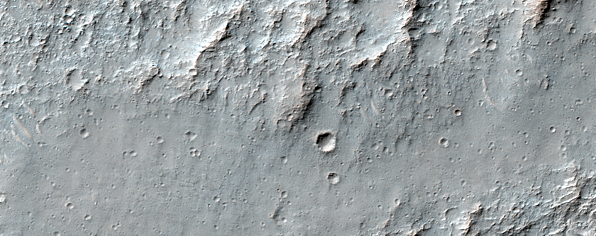 Valleys with Interior Sinuous Ridges in Terrain West of Novara Crater
