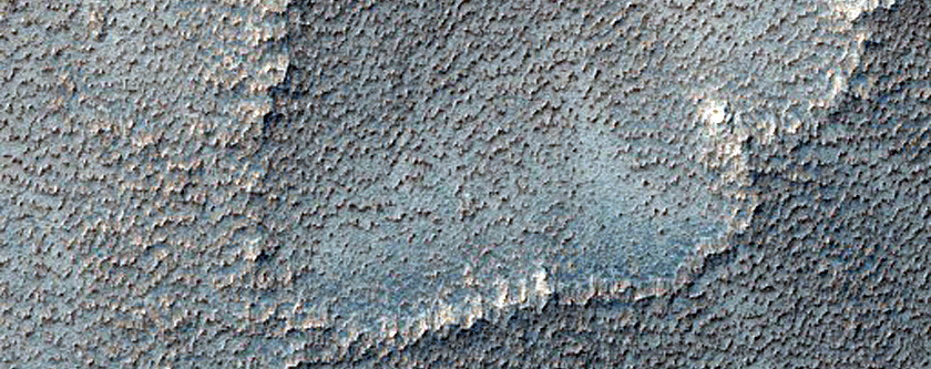 Elongated Pits on Top of Ridge in Syria Planum
