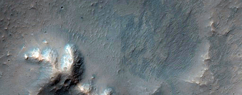 Fresh 5-Kilometer Diameter Crater Near Ophir Catenae
