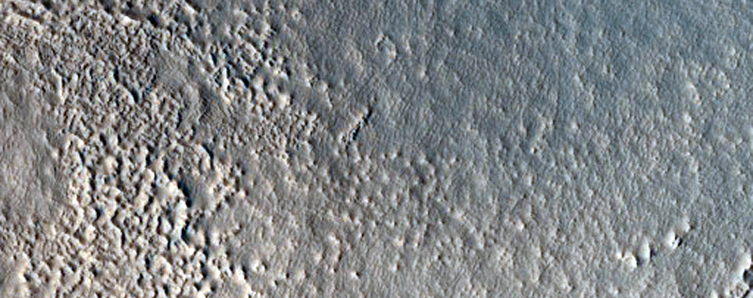 Crater Adjacent to a Scarp in North Tempe Terra
