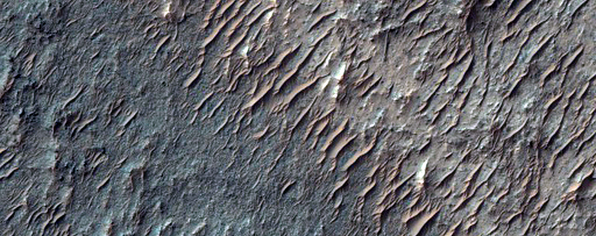 Mesa- and Butte-Forming Material in Circular Surface Feature
