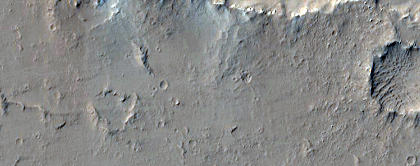 Pits Fissures and Channels East of Olympus Mons
