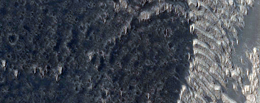 Breached Crater Wall in Daedalia Planum

