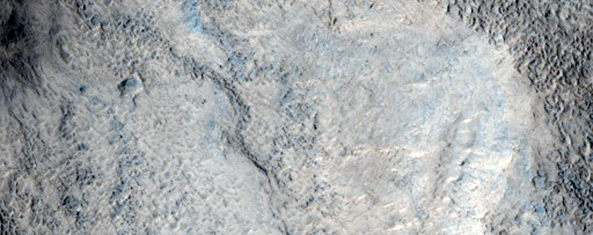 Possible Phyllosilicates in Hummocky Crater Floor along Dichotomy Boundary
