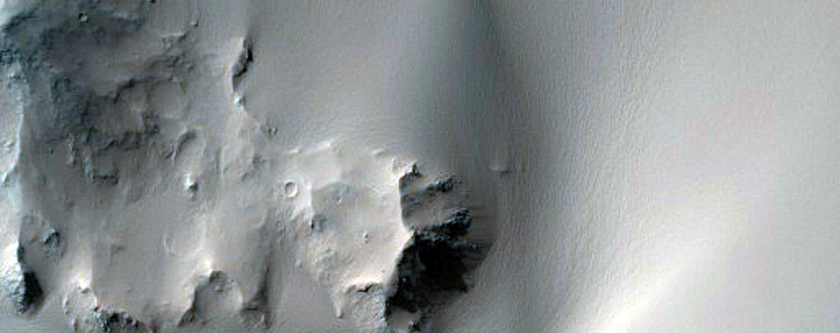 Rim and Terraces of 25-Kilometer Diameter Crater West of Capri Mensa
