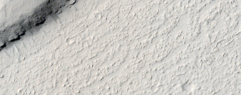 Layers Exposed in Crater Rim in Marte Vallis
