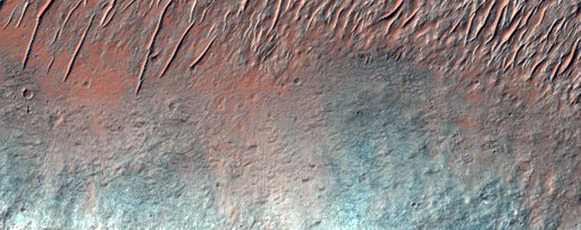 Possible Bedrock Exposures in Degraded Terrain North of Tyrrhenus Mons
