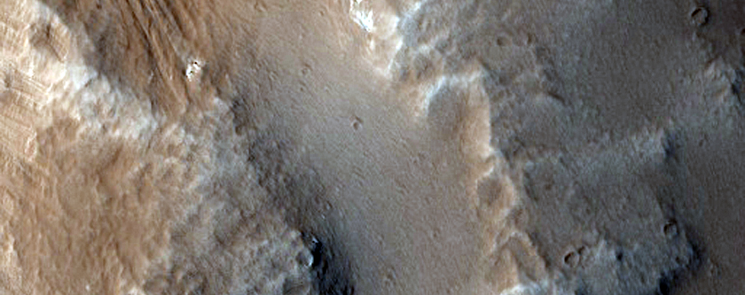 Impact Crater and Channels on Flank of Uranius Tholus

