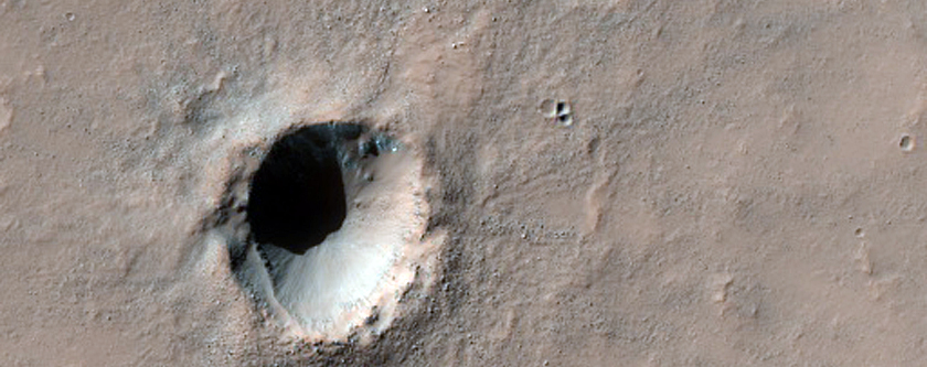 Fresh Small Impact Crater on Layered Bedrock
