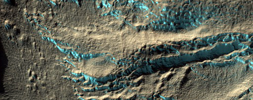 Dipping Layers in Crater in Hellas Montes Region
