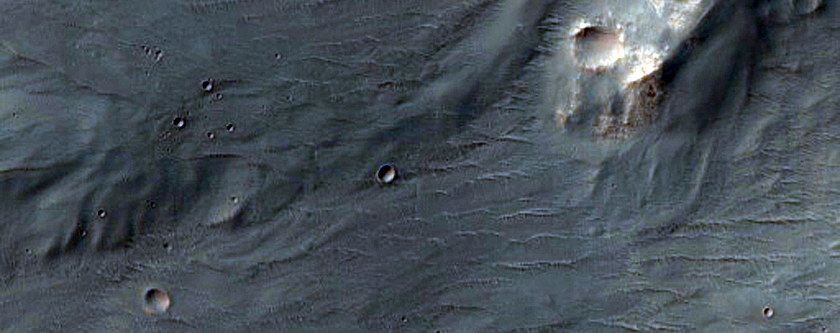 Dark-Toned Deposits on Floor of Blunck Crater
