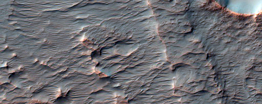 Layered and Fan Material in Crater in Tyrrhena Terra
