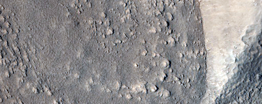 Curved Ridges at Base of Mesa in Protonilus Mensae
