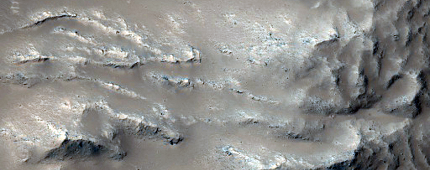 Flow over Crater Rim Onto Crater Floor in Daedalia Planum
