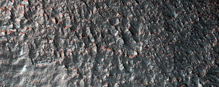 Tongue-Shaped Deposits on Crater Wall in Claritas Fossae

