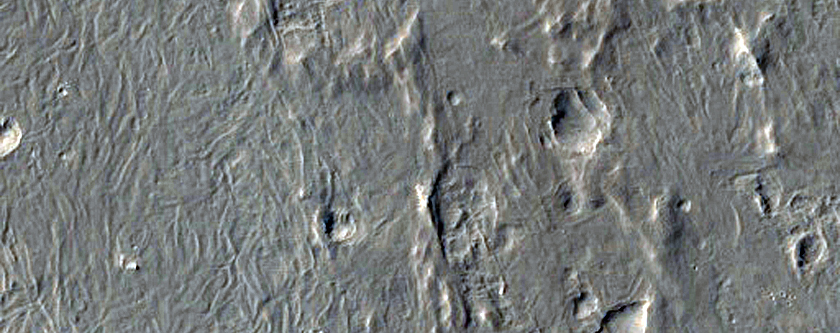 Intersection of Curved Ridges with Mesa-Forming Material
