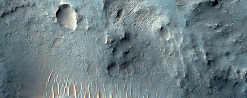Small Tributary Deposit and Transverse Aeolian Ridges in Nirgal Vallis
