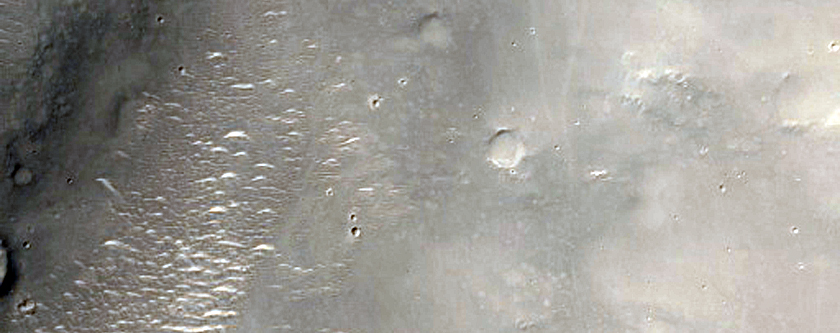 Valley and Crater Deposit in Terra Sirenum
