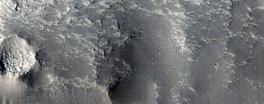 Channel on Crater Rim in Northern Mid-Latitudes
