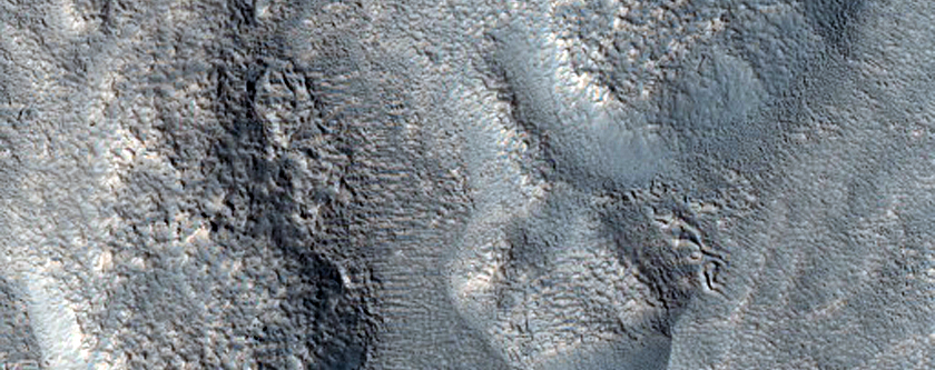Dipping Layers along Crater Rim in Deuteronilus Mensae
