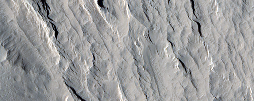 Layered Materials and Blocks in Olympus Mons Aureole