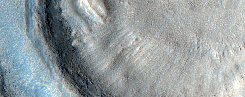 Dipping Layers in Crater in Northern Mid-Latitudes

