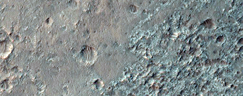 Spectrally Anomalous Crater Ejecta
