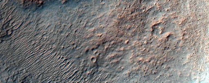 Impact Crater Exposing Bedrock
