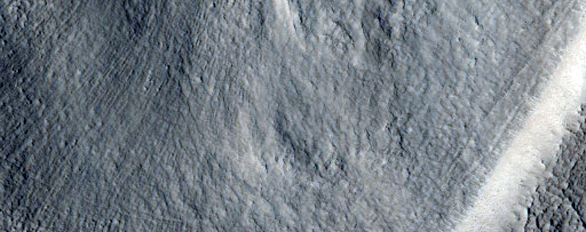 Layered Deposits in Small Craters in Northern Plains