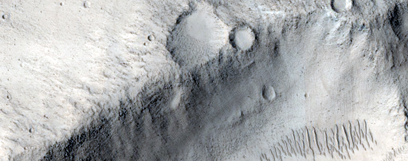 Elongated Crater North of Tartarus Montes
