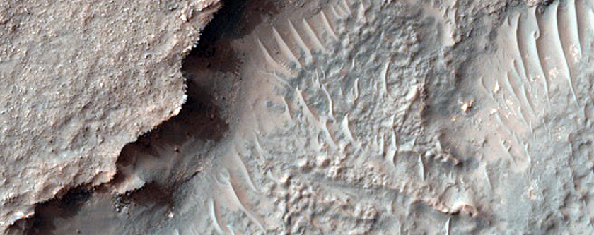 Fan-Shaped Feature in Pit in Crater in CTX Image