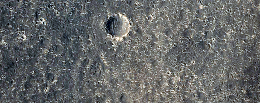 Crater Ejecta Material in Contact with Mesas and Buttes
