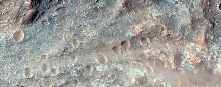 Impact Crater Exposing Bedrock
