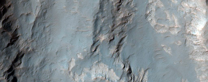 Pit with Rock Exposure Northwest of Hellas Region
